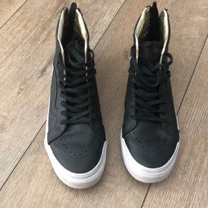 Black leather high top vans